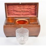 A Regency mahogany tea chest of bombe shape fitted two caddies and a cut glass central bowl.