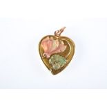 An Art Nouveau enamelled gold heart. Condition Report: Back has minor dents and scratches, signs