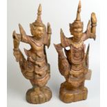 A pair of Balinese gilt, carved wood figures of dancers, height 53cm.