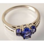 A diamond and tanzanite 9ct. white gold ring.