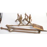 A pair of Victorian brass fire dogs and a set of brass fire irons. Condition Report: good