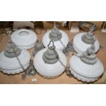 A set of six white glass moulded pendant lights, with fittings. Condition Report: Very minor surface