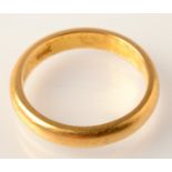 A 22ct. gold band, 4.7g.  Condition Report: size K