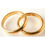 An 18ct. gold band, 4.8g. and a 22ct. gold band, 5.2g.  Condition Report: 22 ct. band is O/P.  18ct.