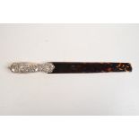 A William Comyns paper knife with tortoiseshell blade.