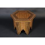 A fine eastern, hexagonal coffee table, the whole covered with an intricate,