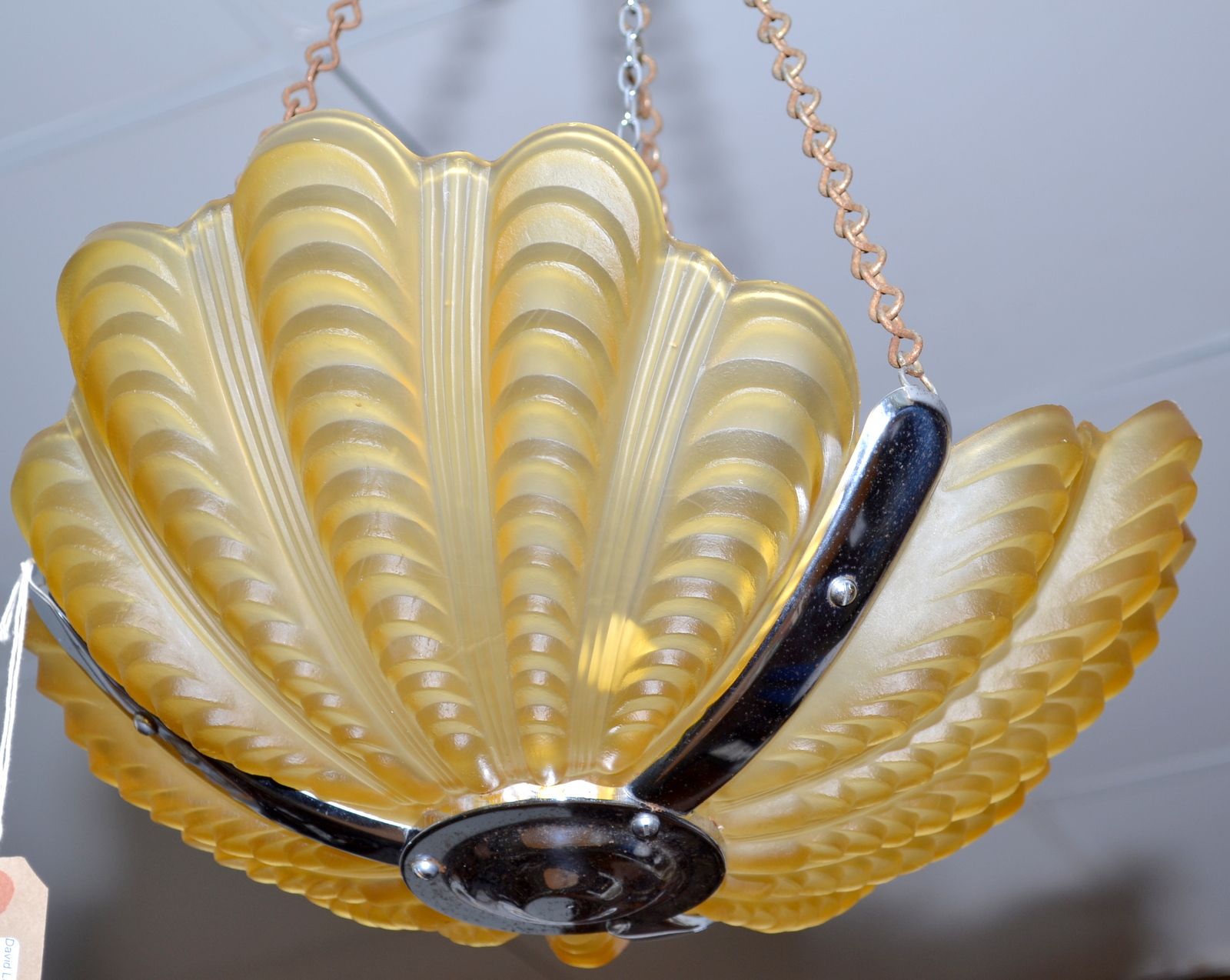 An Art Deco shell moulded, triple amber glass pendant light fitting with chrome frame.  Condition