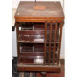 A mahogany, revolving bookcase with satinwood crossbanding. Condition Report: Height is 86cm.- Sound