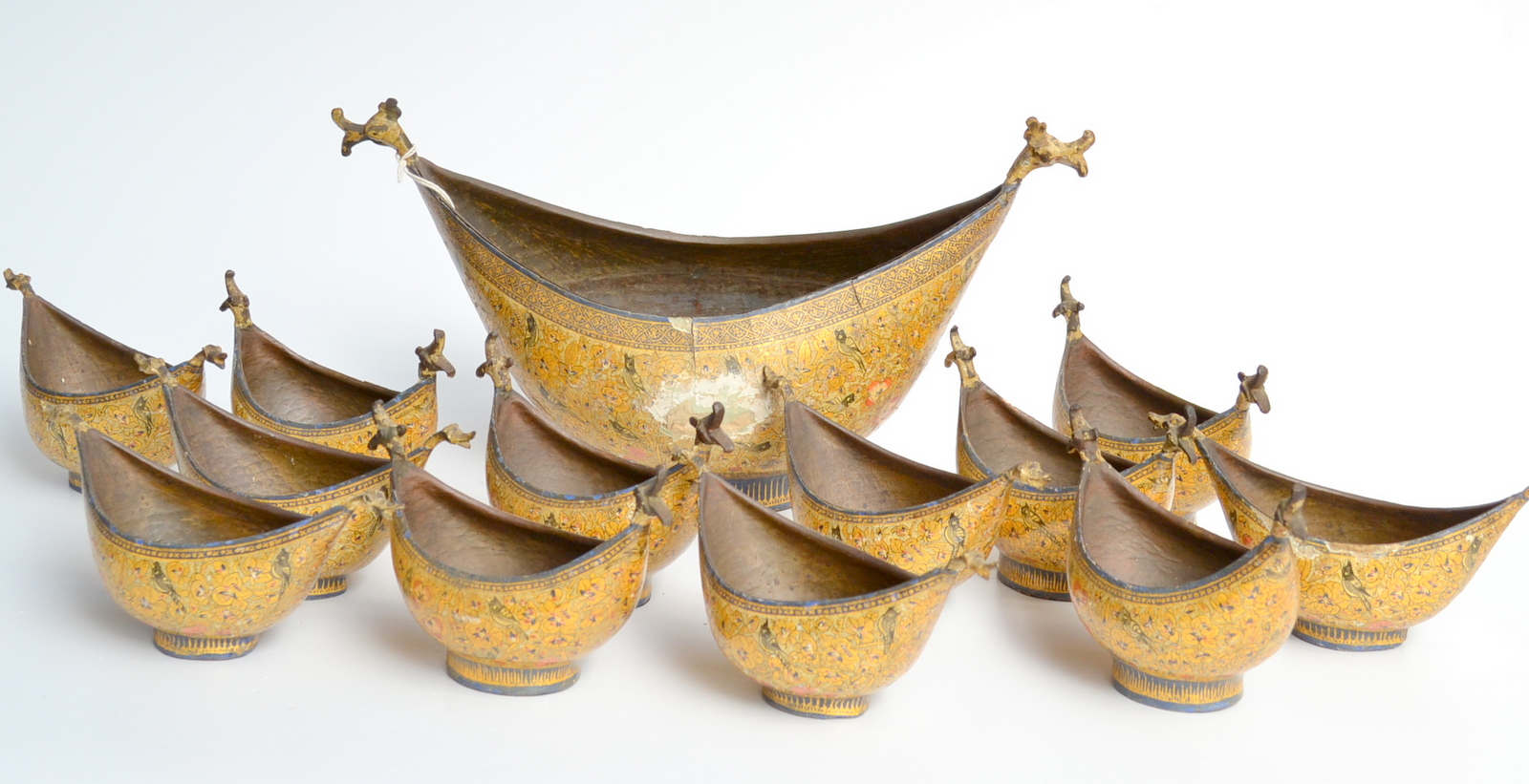A collection of thirteen lacquered, papier mache, Kashmir Kashkul bowls. One 37cm the others approx.