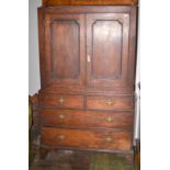 A George III oak linen press, lacks cornice. Condition Report: 114cm wide, 49cm deep and 195cm high.