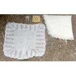 Two cream woollen blankets, together with a pair of white kid gloves in an embroidered pouch.