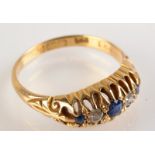 An 18ct. gold sapphire and diamond claw set ring.