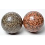 Two Scottish granite balls one grey the other pink. Diameter 9cm.