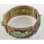 A Chinese silver bracelet with carved jade bats amongst enamel clouds.
