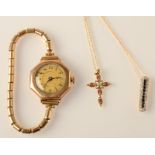 A ladies octagonal wristwatch, a diamond and sapphire pendant and one other pendant.