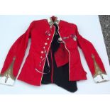 Two red military jackets. Condition Report: The items are small, there are no tailoring labels.