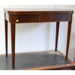 A George III mahogany, fold top tea table with inlaid lines.