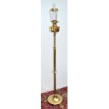 An Arts & Crafts brass standard lamp with Messenger's no.2 burner. Condition Report: good condition,