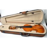 A violin, the two piece back with slightly descending narrow curl, length of back 35.5cm.