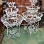 A pair of wire, three tier, plant stands in Victorian style.