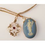 A jasper gold mounted pendant on gold chain and one other gold pendant and chain.