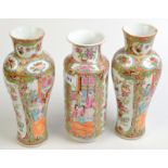 A pair of 19th century Cantonese baluster vases, one damaged, together with a third matching vase of