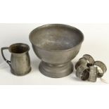 A Liberty pewter small mug, five pewter napkin rings and a heavy Solkets footed bowl.