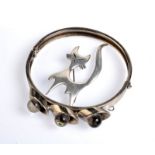A Rasmussen & Lassen Danish silver cat brooch and a Danish style metal bracelet.