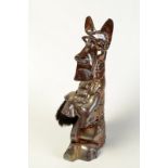 A companion set on an anodised metal stand cast as a begging Scottish terrier height 41cm.