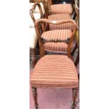 A set of four mid Victorian walnut balloon back chairs.