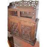 A n Anglo-Indian carved side cabinet, width 121cm, height 168cm. Condition Report: There are 2