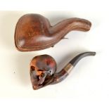 A meerschaum skull and crossbones pipe in fitted case. Condition Report: Signs of use, no cracks