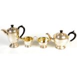 A silver four piece faceted tea service with gilt interior, by Viner's Ltd., Sheffield, 1937, 37.