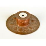 A Newlyn copper ink stand decorated with medlars, impressed mark, diameter 19.2cm.