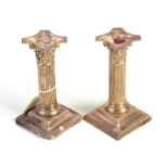 A pair of Edwardian silver Corinthian column candlesticks on square, beaded bases, height 15.