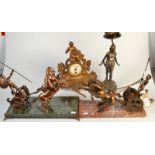 Two cast brass chariots, an Art Nouveau sculptural table lamp and a sculptural mantel clock.