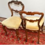 A set of six Victorian rosewood carved balloon back dining with cabriole legs.