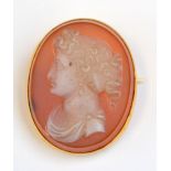 A hardstone carved cameo gold mounted brooch.