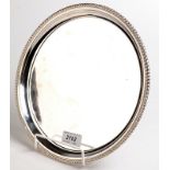 A Canadian circular silver card tray with beaded border by Birks Sterling, 485gms, 25.7cm.