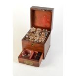 A medicine chest in mahogany with inset brass handle,