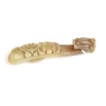 A Chinese carved jade belt hook.