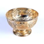 A Victorian silver pedestal bowl embossed with scrolls and flowers, by James Deakin & Sons,