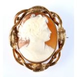 A Victorian engraved gold mounted cameo brooch, carved with the head of a young woman. Condition