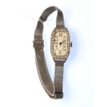 A platinum and diamond Art Deco cocktail watch, on 19ct. white gold mesh bracelet.