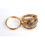 A 22ct. gold band, 3.8g. and a 9ct. gold ring set with diamonds.