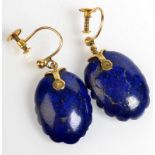 A pair of shell shaped lapis lazuli screw back earrings, each set with a single diamond,