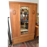 A good 1920's light oak bedroom suite, comprising a wardrobe 114cm, a dressing chest 98cm, a wash