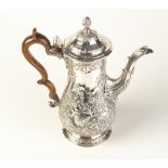 A George III silver coffee pot of baluster form with domed, hinged cover, wooden handle and acanthus