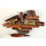 A collection of cheroot and cigarette holders many with amber.