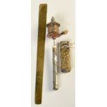 A Japanese knife handle, a prayer wheel and an oriental paper knife.